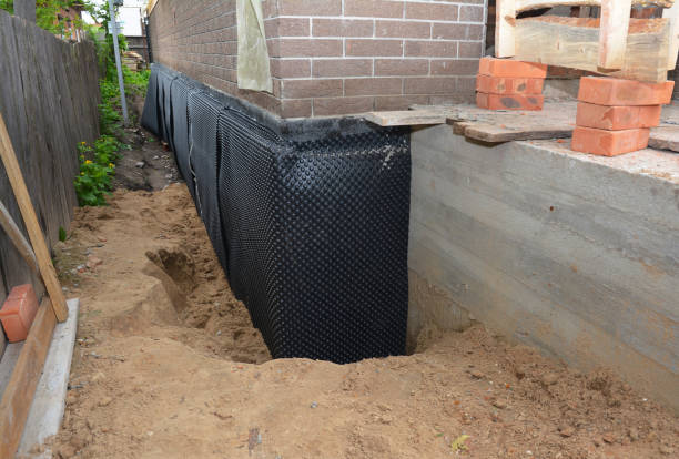 Happy homeowners after waterproofing job in North Hampton